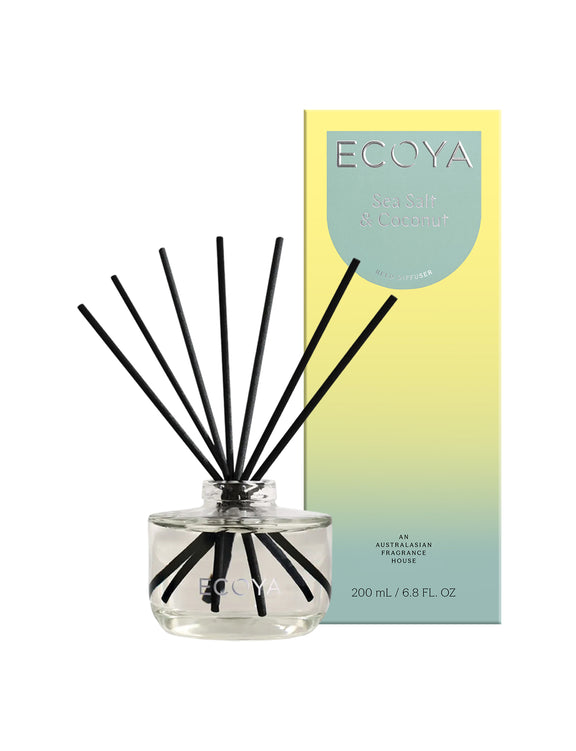 Ecoya Sea Salt and Coconut reed diffuser in a sleek glass vessel with black reeds.