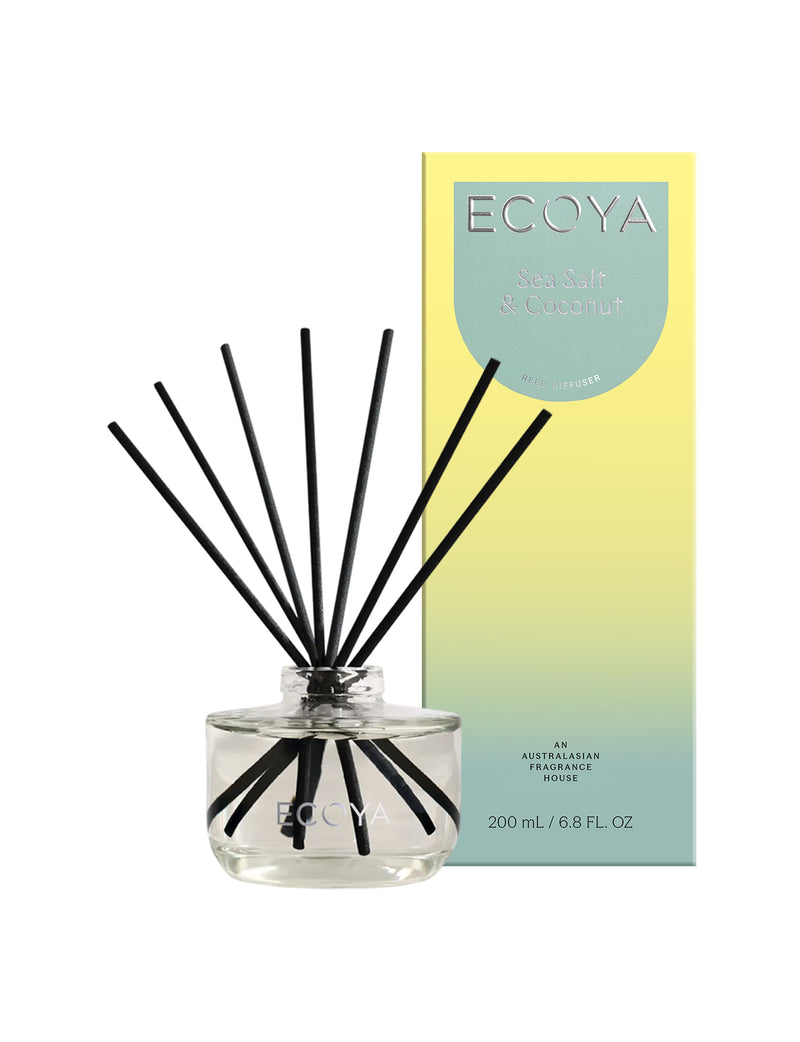 Ecoya Sea Salt and Coconut reed diffuser in a sleek glass vessel with black reeds.