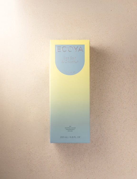 Ecoya Sea Salt and Coconut home fragrance reed diffuser with elegant glass vessel.