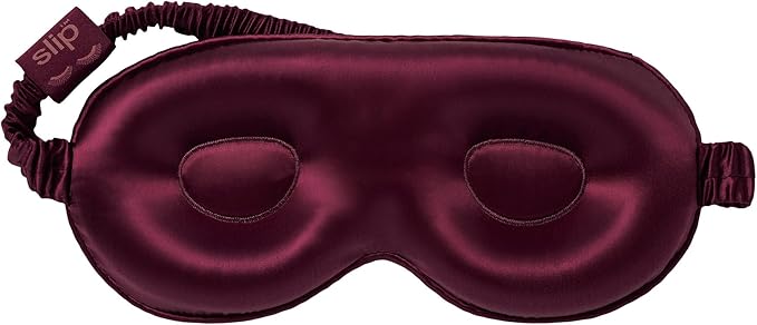 Close-up of Crimson Slip Silk Contour Sleep Mask showing contoured interior.