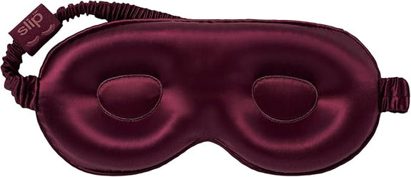 Close-up of Crimson Slip Silk Contour Sleep Mask showing contoured interior.