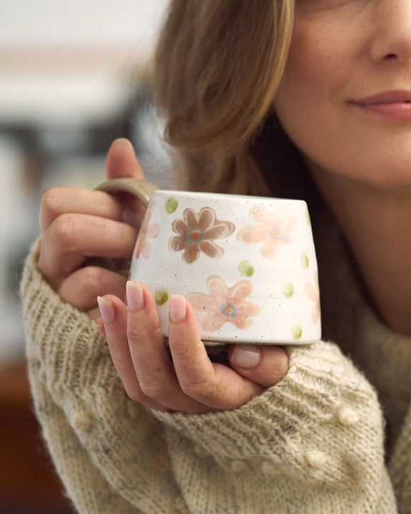 Large handled floral mug featuring colourful hand-painted details and unique glazed stoneware finish