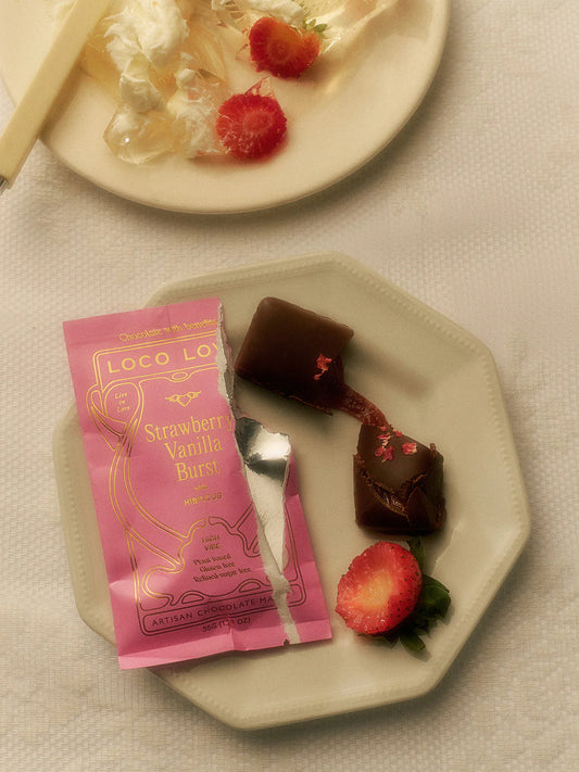 Vegan strawberry chocolate by Loco Love with strawberry, vanilla bean and hibiscus.
