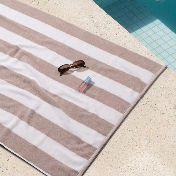 Neutral cabana style beach towel sand