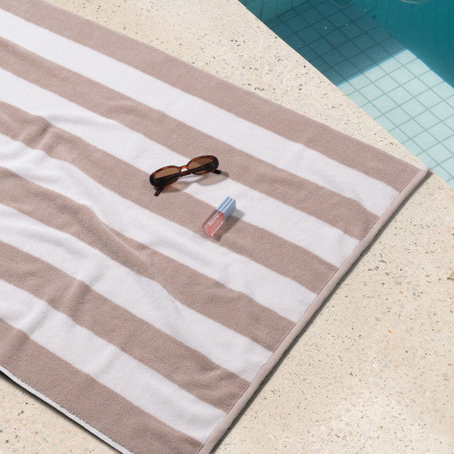 Neutral cabana style beach towel sand
