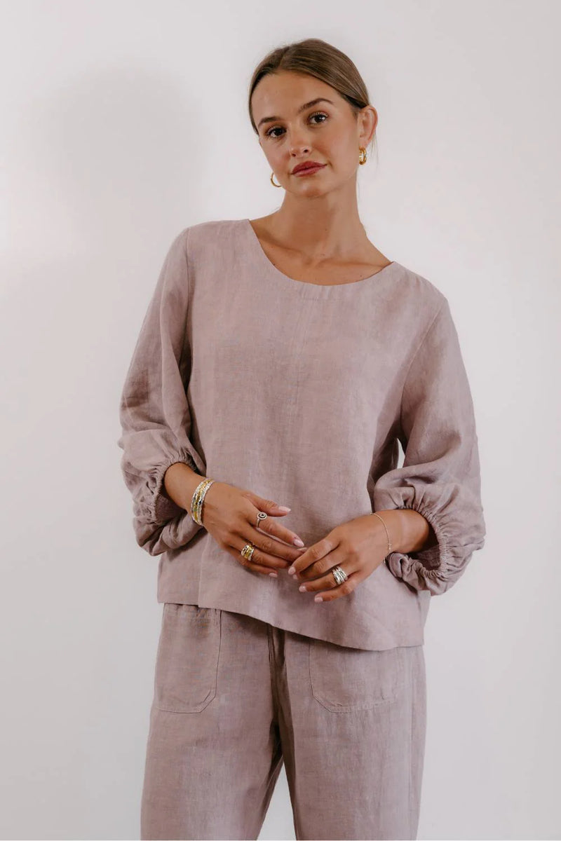 Eadie Lifestyle Tess Top in lilac linen featuring gathered 7/8 sleeves and a relaxed fit silhouette.