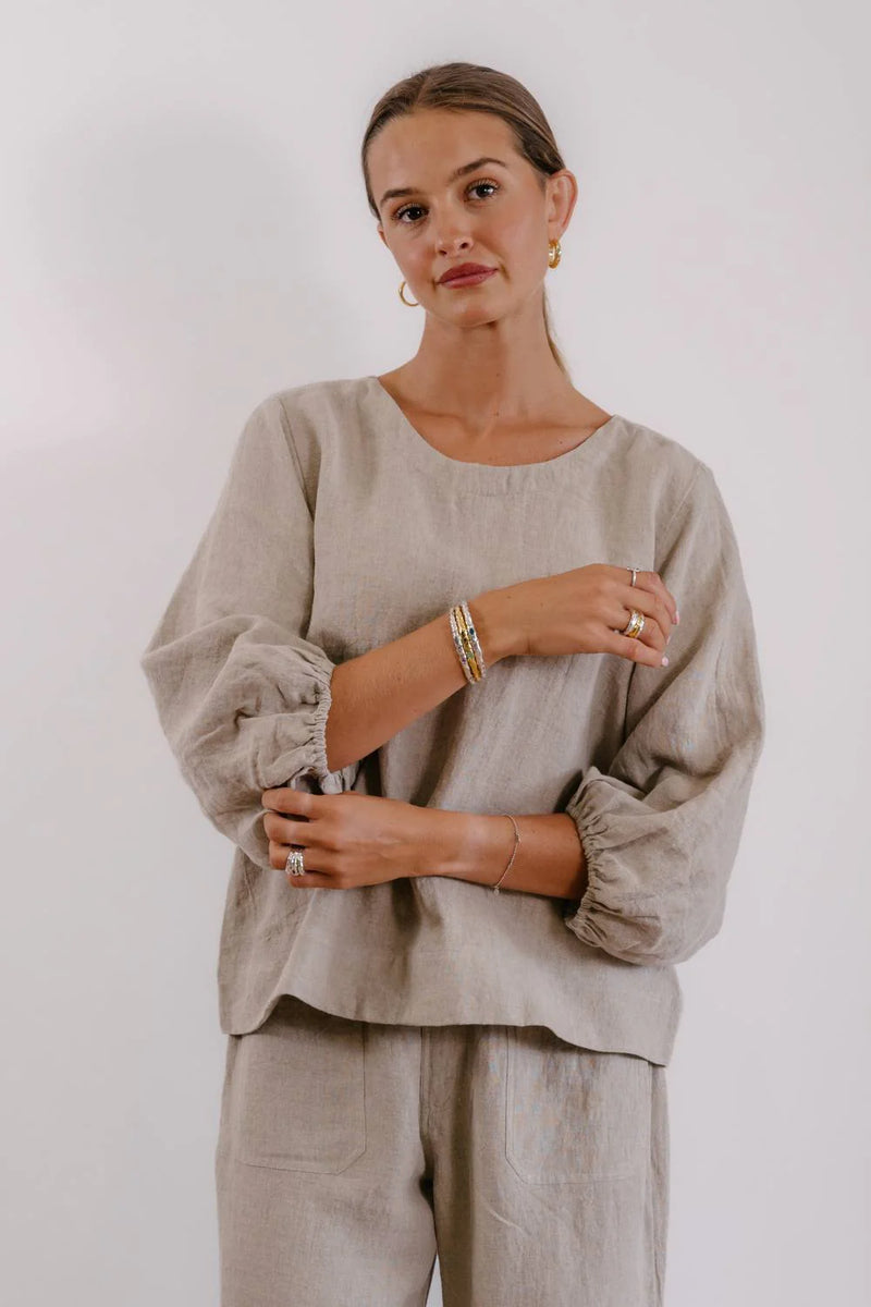 Eadie Lifestyle Tess Top in natural linen with gathered 7/8 sleeves and relaxed fit silhouette.
