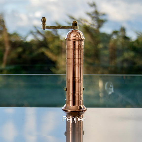 Handcrafted Greek copper pepper mill with traditional crank handle