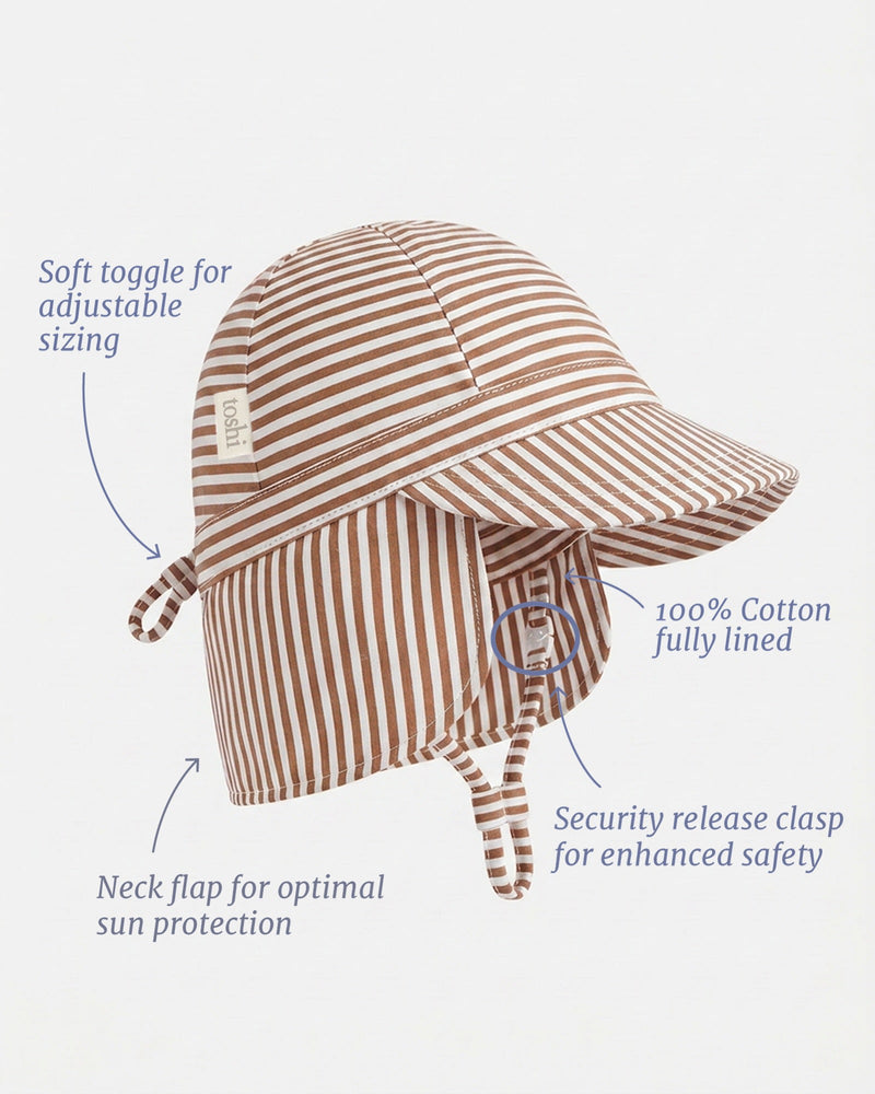 Baby cotton flap cap with protective neck flap, adjustable ties and safety-release clasp by Toshi.