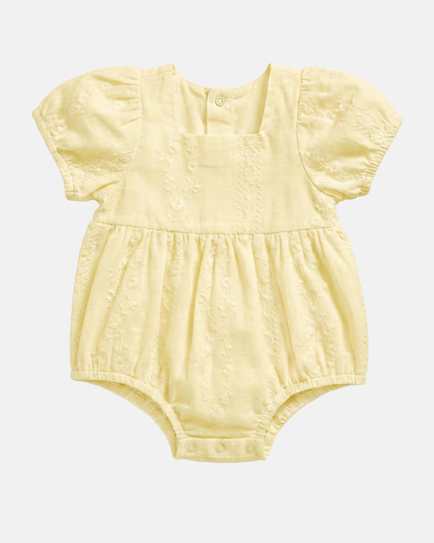 Toshi Baby Romper Florence Lemon in soft lemon yellow with embroidered fabric and puff sleeves.