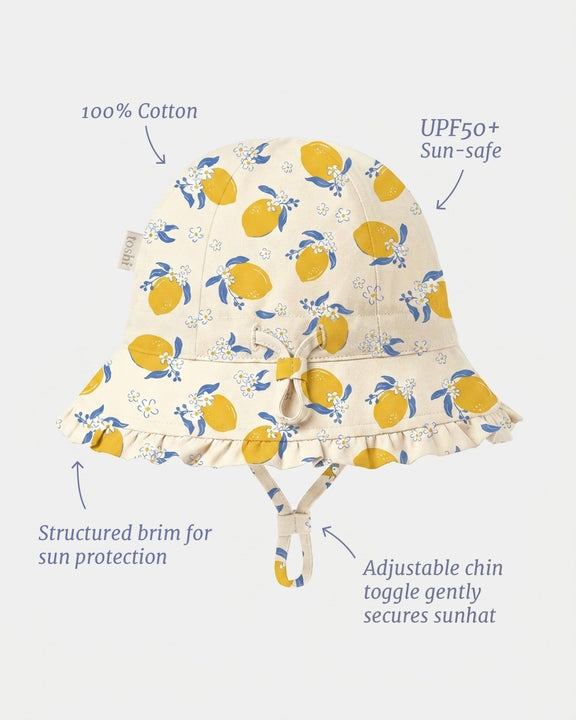 Toshi Bell Hat Arcadia Lemonade Cream baby sun hat with soft frilled brim.Cotton UPF50+ sun-safe hat with adjustable toggle.