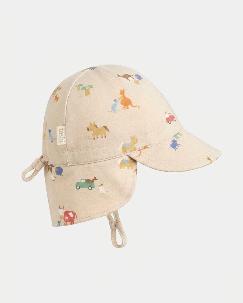 Toshi Flap Cap Arcadia Station Hands baby sun hat with country-inspired print.
