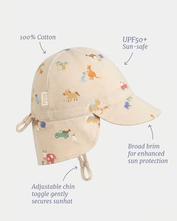 Toshi UPF 50+ baby flap cap featuring the Arcadia Station Hands design.