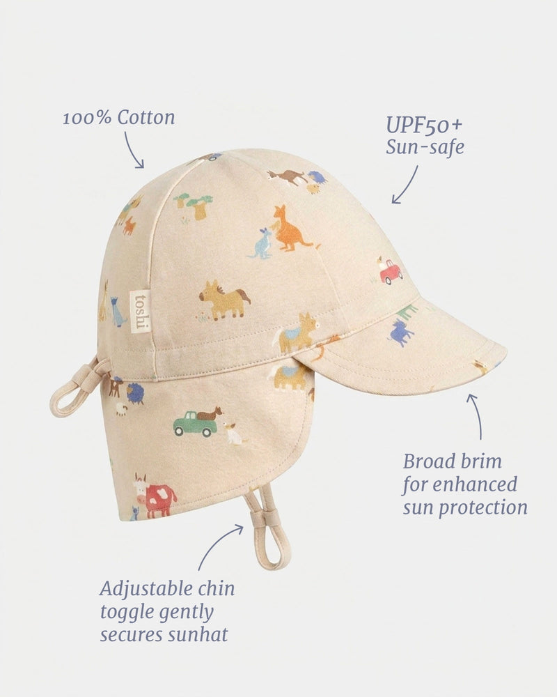 Toshi UPF 50+ baby flap cap featuring the Arcadia Station Hands design.