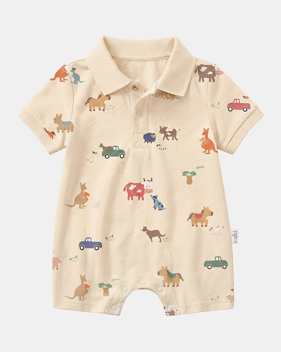 Cotton baby polo onesie in Toshi Station Hands print