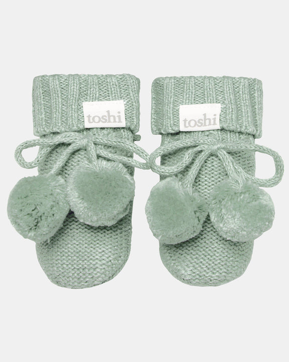 Jade organic cotton knitted baby booties with pom poms