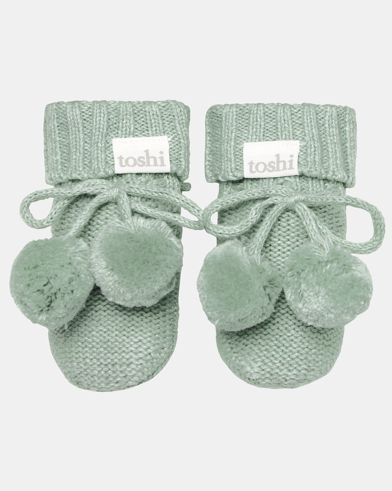 Jade organic cotton knitted baby booties with pom poms