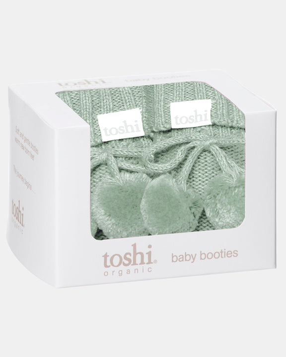 Marley organic baby booties in Jade presented as a newborn gift