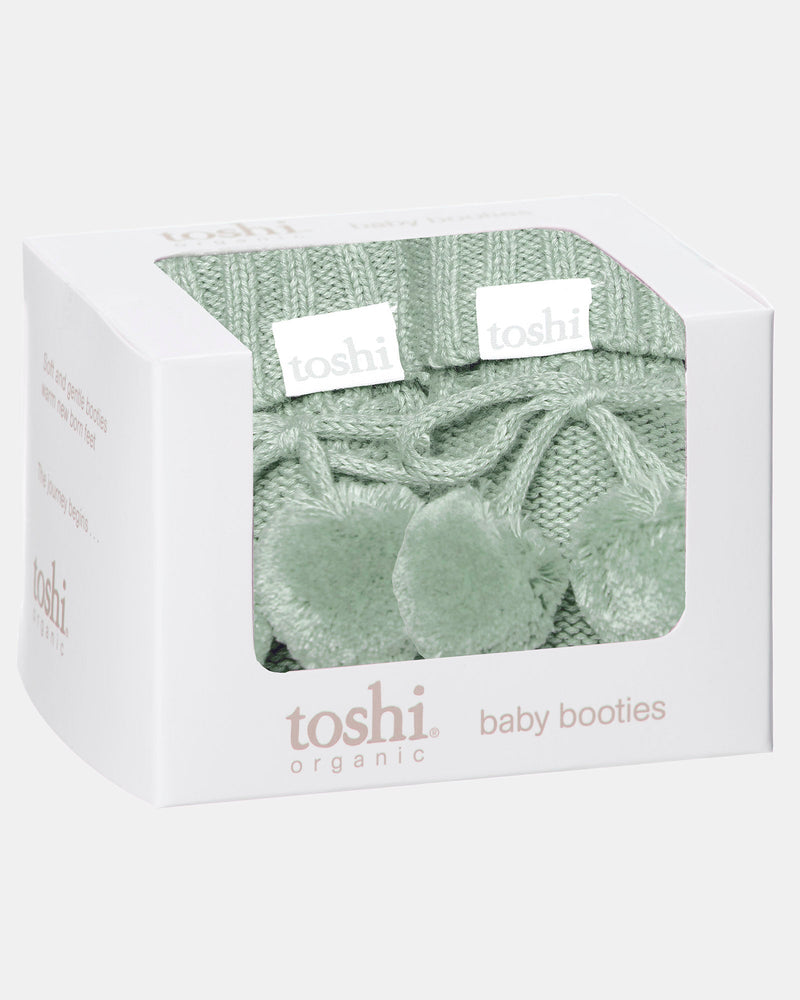 Marley organic baby booties in Jade presented as a newborn gift