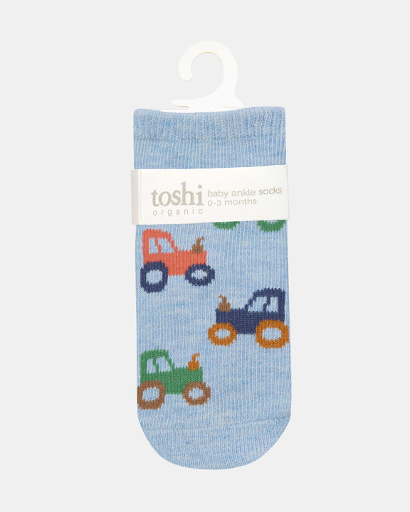 Organic baby socks featuring a playful tractor pattern