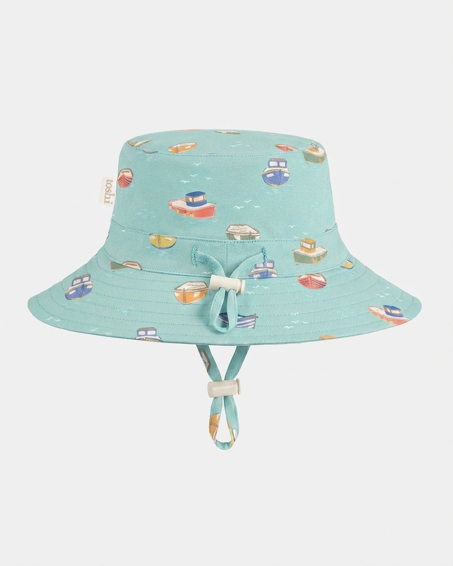 Toshi Sunhat Tide Tugboat children's sun hat with playful tugboat print.