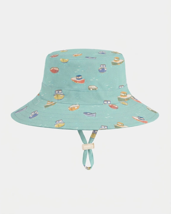 Children's cotton sun hat with adjustable toggle and safety-release chin strap by Toshi.