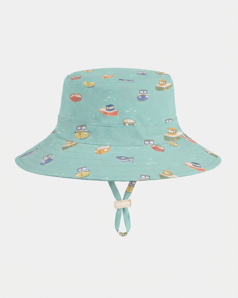 Children's cotton sun hat with adjustable toggle and safety-release chin strap by Toshi.