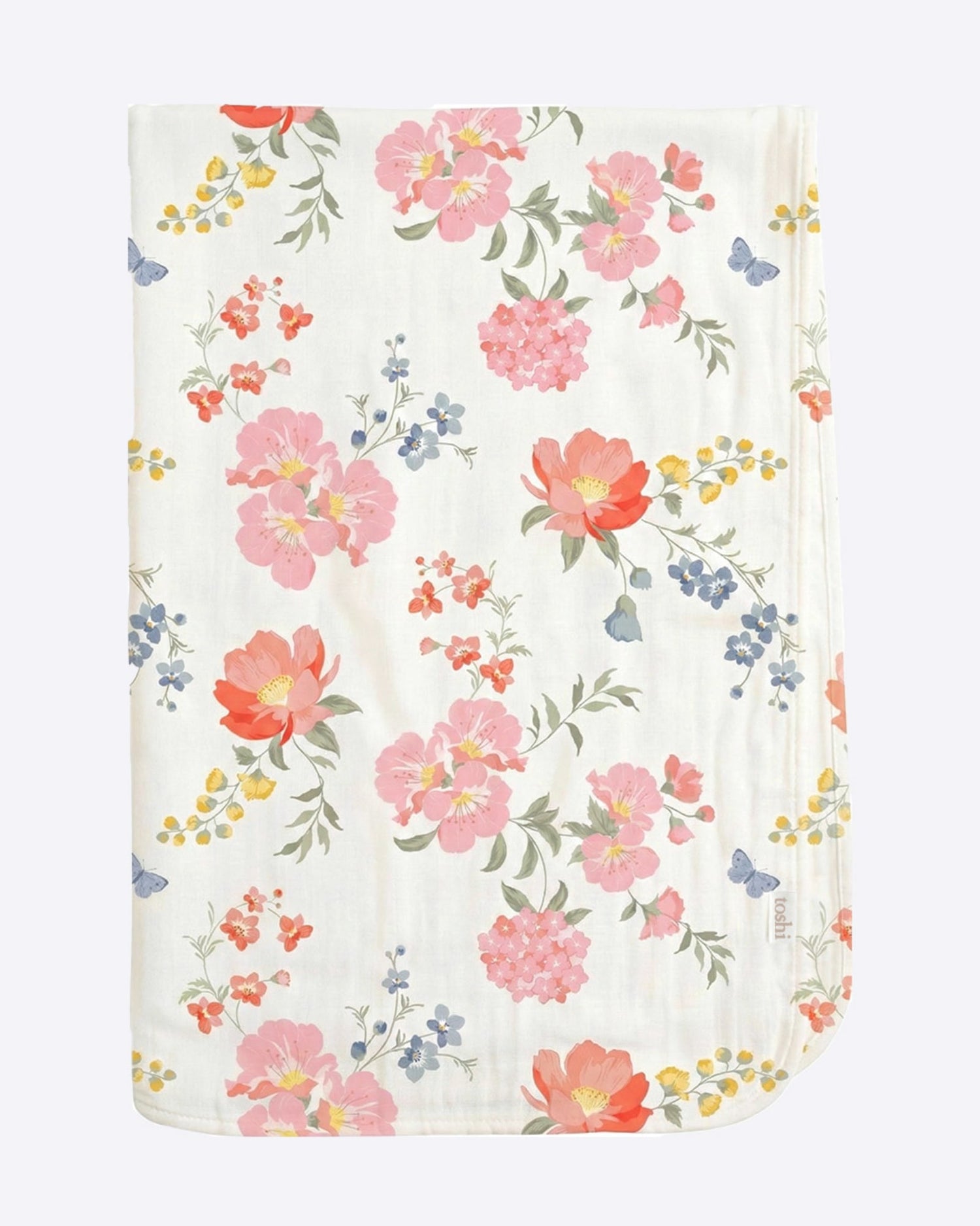 A folded muslin baby blanket with a delicate floral print on a white background, featuring pink, orange, and blue flowers with green leaves and yellow accents.