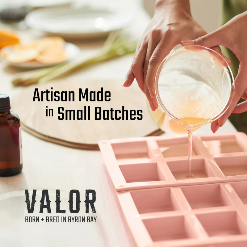 Person pouring a liquid into a pink silicone mold with 'Valor' branding and text about artisanal production.