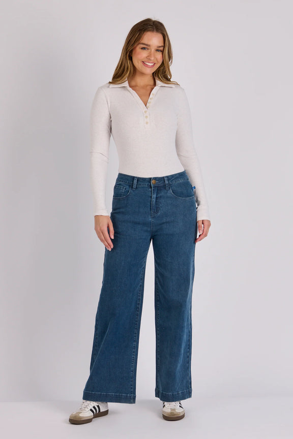 Women's wide leg cropped jeans in mid blue denim with stretch fabric and classic pocket detailing.