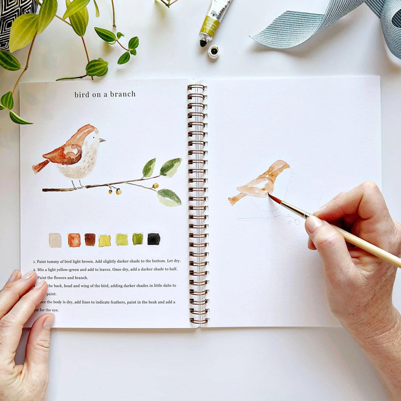 Watercolour painting workbook featuring dogs cats bunny deer and other animals