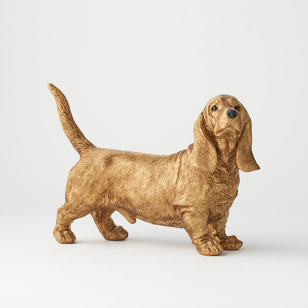 Beau dachshund dog sculpture in antique gold