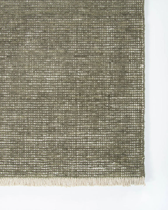 textured green rug
