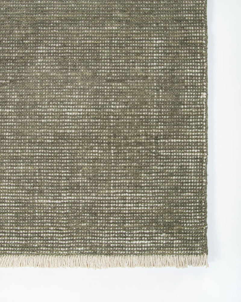textured green rug