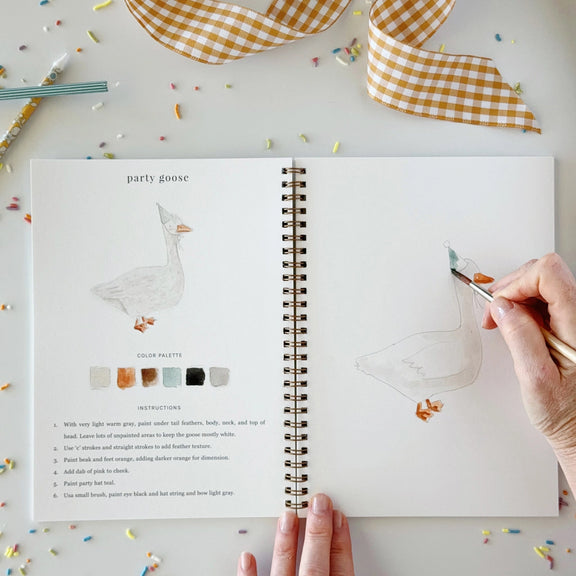 Celebrate Watercolour Workbook with lightly sketched birthday designs