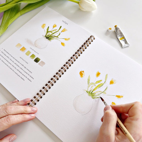 Watercolour workbook featuring bunny chick tulips and Easter basket