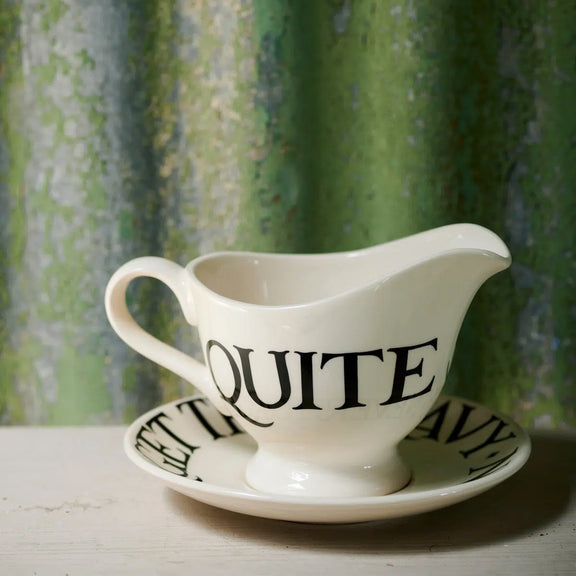 Black Toast gravy jug with matching earthenware stand