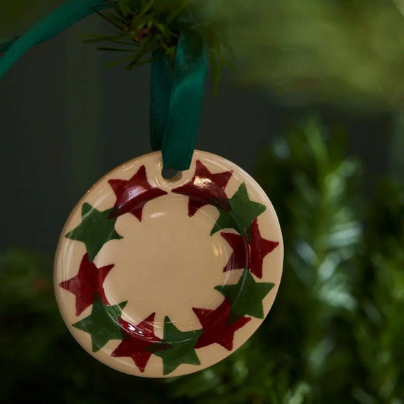 Miniature Christmas Stars plate ornament with red hanging ribbon