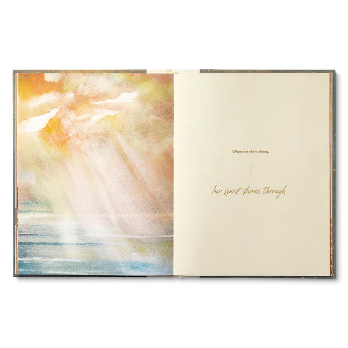 Open book with abstract art on one page and text on the other, on a white background