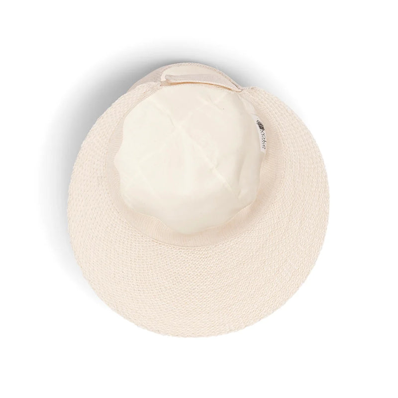 Ivory ponytail-friendly cap for golf and travel