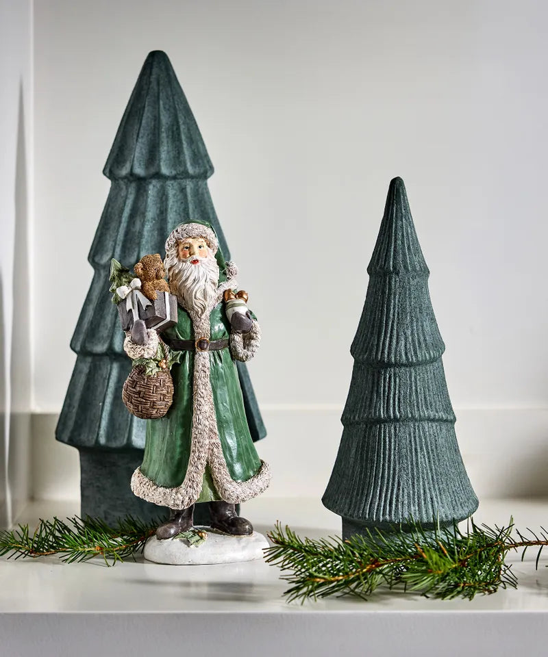 Traditional Santa carrying a bear and Christmas gifts 