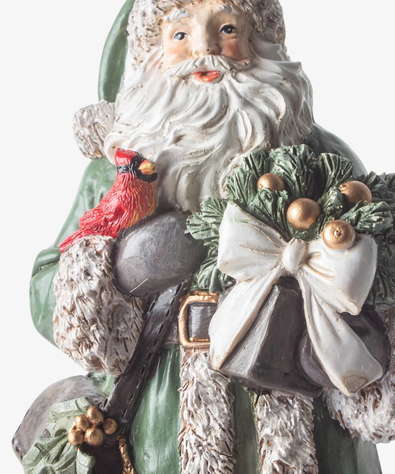 Festive Santa carrying bells and gifts for traditional Christmas display 
 
