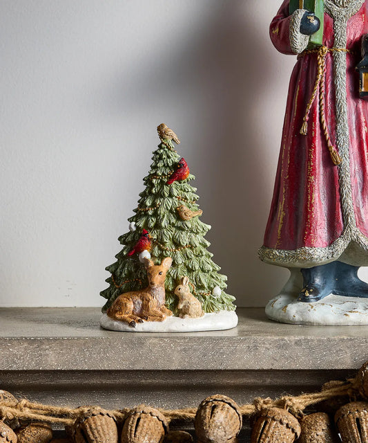 Festive woodland Christmas tree figurine with animals around the base 