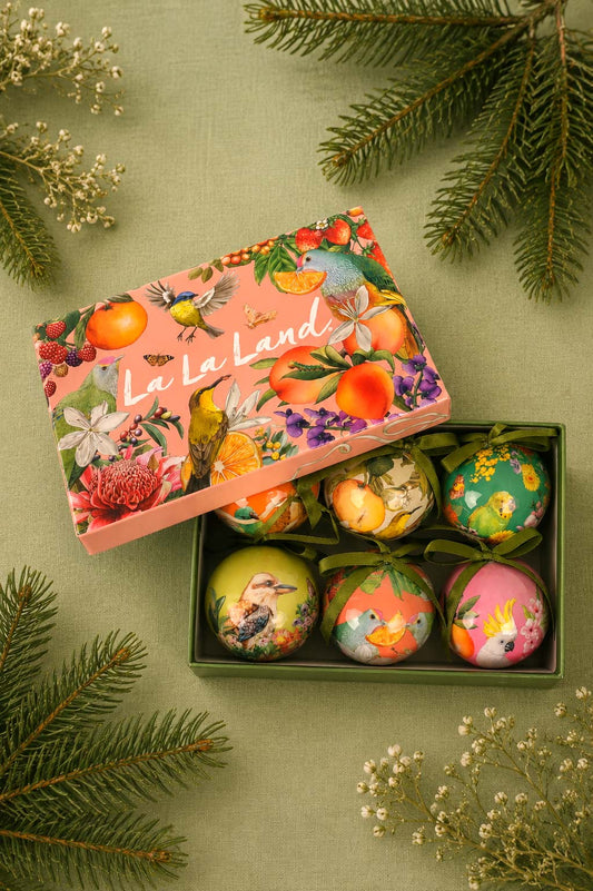 Six illustrated Christmas baubles with fruit and botanical designs