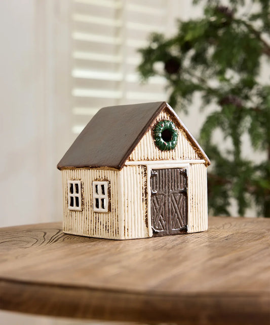 Off white Scandinavian Christmas stable with decorative wreath 