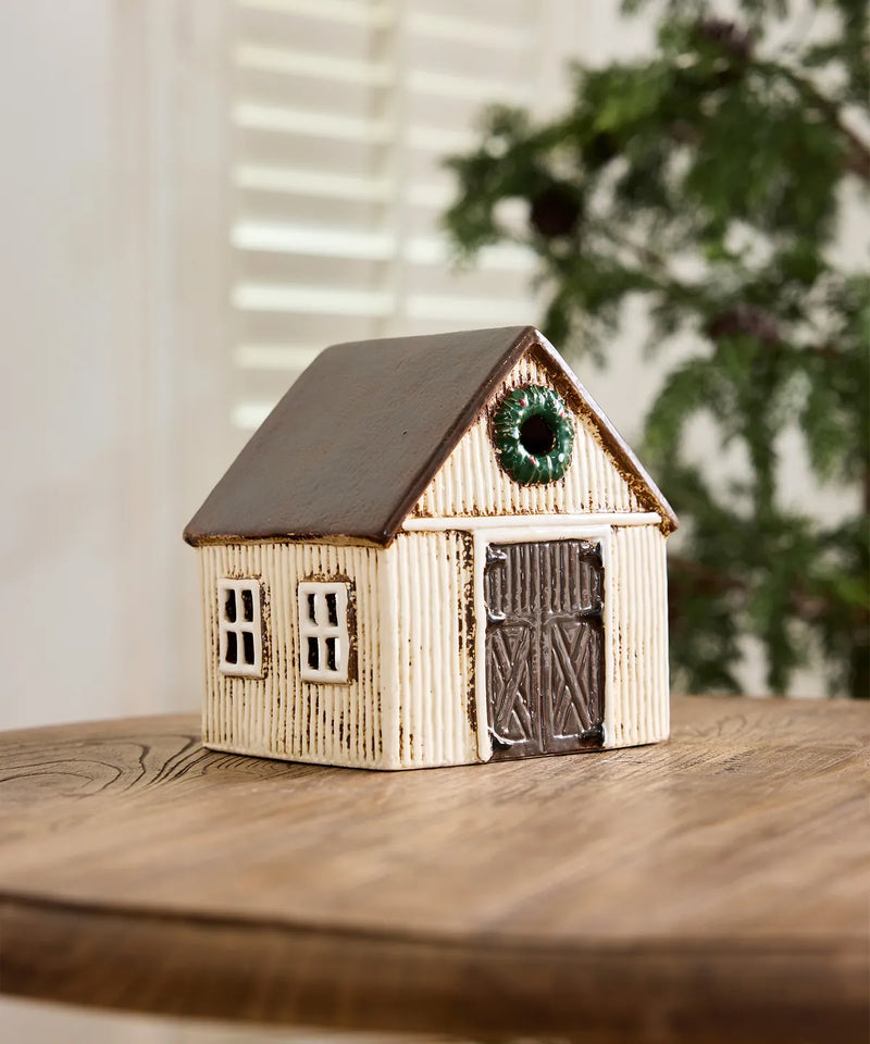 Off white Scandinavian Christmas stable with decorative wreath 