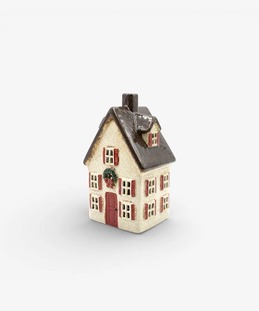 Tall Nordgard Christmas village villa with festive bow wreath