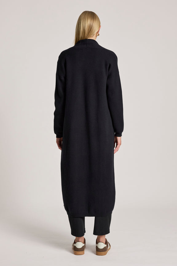 Back view of long black women's cardigan