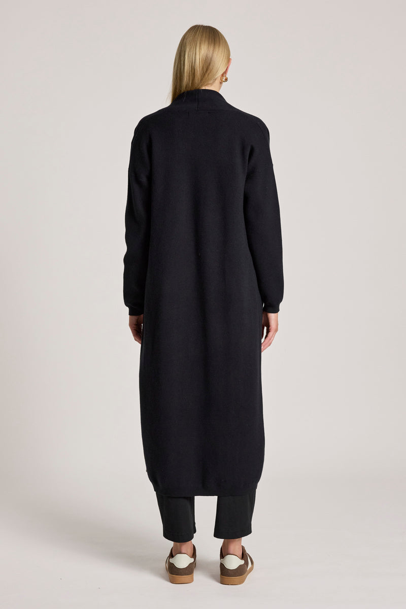 Back view of long black women's cardigan